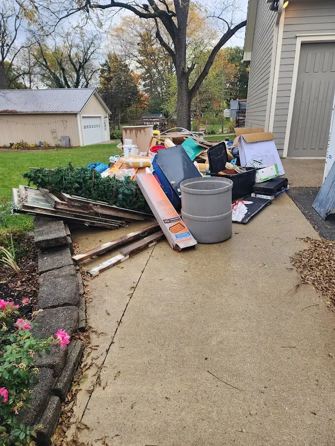 Dumpster being loaded with debris for Residential Dumpster Rental in Portales